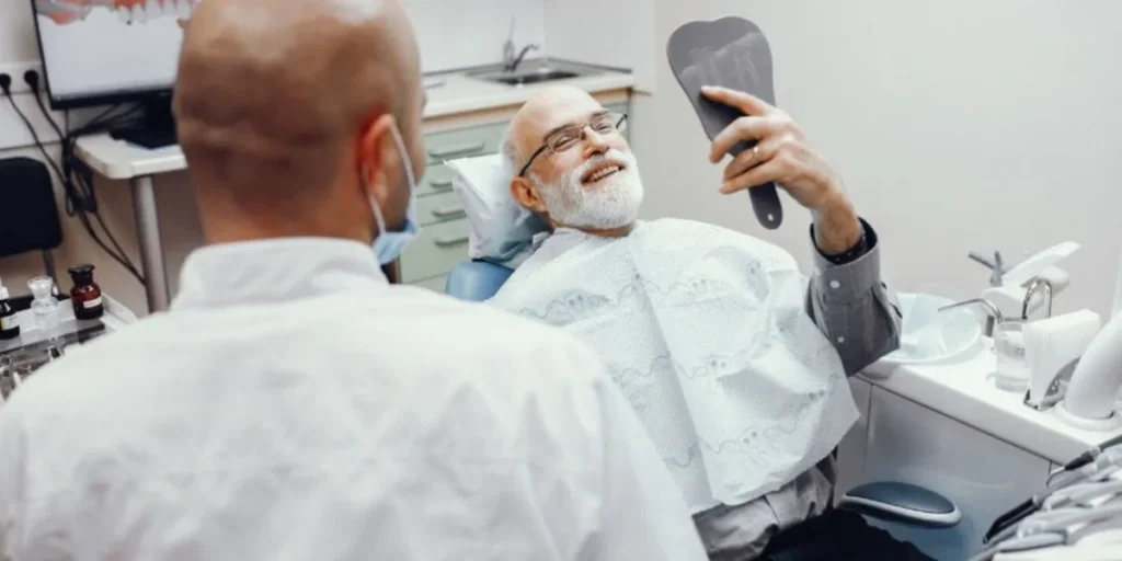 Senior with dentist accepting Cigna Medicare Atlanta care