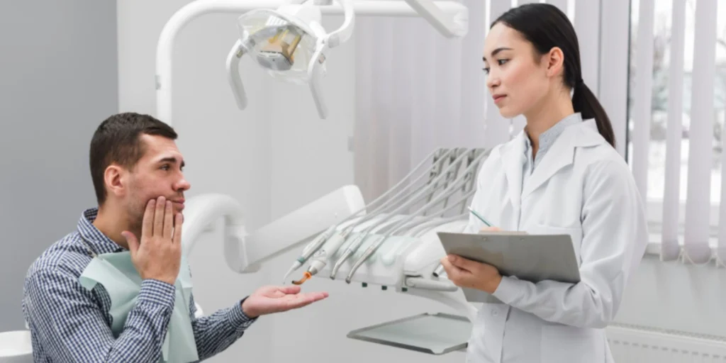 Man getting emergency walk in dental care Atlanta for tooth pain