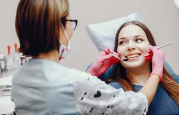 Dentist performing routine dental checkup and cleaning