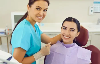 Dentist consulting patient during emergency dental visit