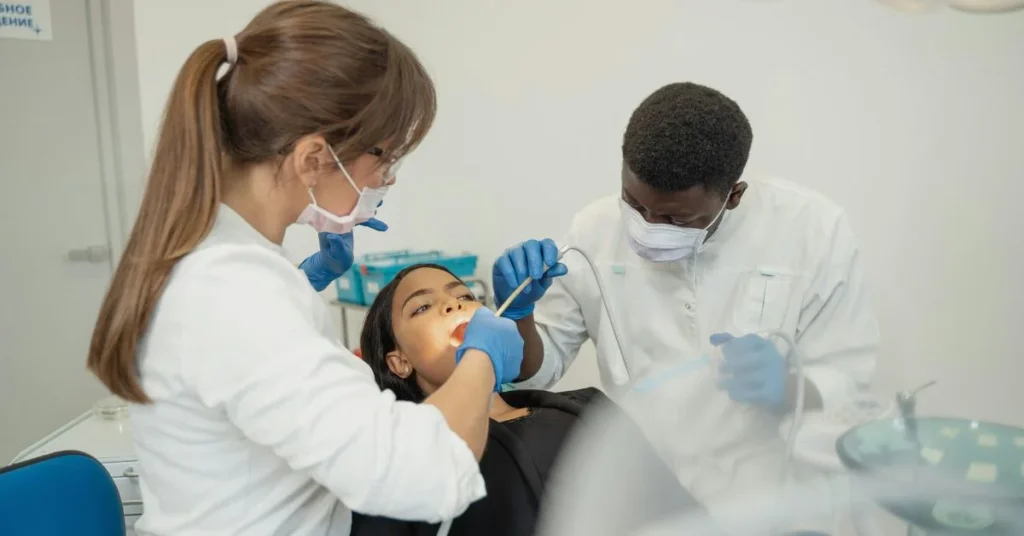 Dental team providing urgent treatment for dental emergency